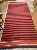 A large red, blue and white rug