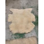 Two white Faux fur rugs