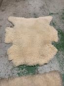 Two white Faux fur rugs