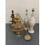 A selection of table lamps including gilt cherub an ship style wall light