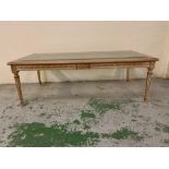 A Glass topped coffee table on reeded legs