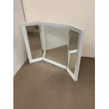 A vanity mirror with hinged sides