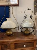 Two hanging lampshades with opaque glass shade and metal frames