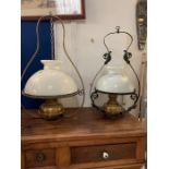 Two hanging lampshades with opaque glass shade and metal frames