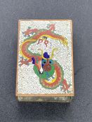 A Cloisonne Chinese Dragon themed matchbox holder.