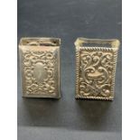 Two silver matchbox holders.