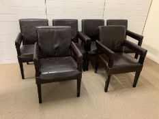 Six faux leather matching dining armchairs with brown faux leather by Andrew Martin London.