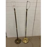 A Pair of Brass reeded floor lamps