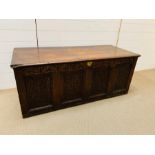 An 18th century panelled oak coffer (H55cm W135cm D55cm)