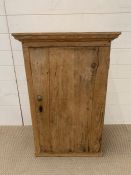 A pine cupboard with lock and key (H86cm W54cm D35cm)