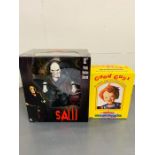 A SAW 12" Push Button Character and a Neca 'Chucky' Headknocker