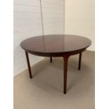 An extendable Dining room table (H76cm Diam 122cm)