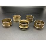 A Selection of Five various hallmarked silver napkin rings.