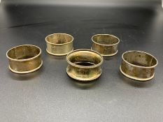 A Selection of Five various hallmarked silver napkin rings.