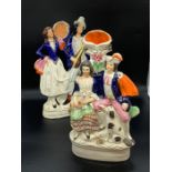 Two Staffordshire figural groups, one couple holding musical instruments, one couple sat with