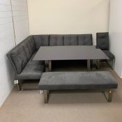 A dining room suite comprising of an L shape sofa, bench and chairs in grey suede