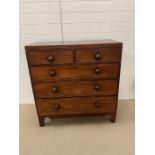 Three over two chest of drawers on raised bracket feet.(H104cm W100cm D47cm)