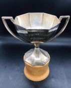 A Hallmarked silver trophy on wooden stand Birmingham Hallmark 1939 by A.J Zimmerman Ltd. (