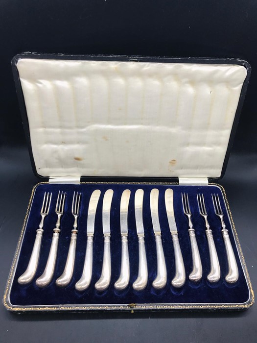 A Cased set of Pistol gripped silver handled, six knives and forks, by JS & S Hallmarked Sheffield