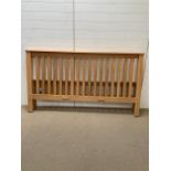 An oak six foot bedframe with all fittings and instructions