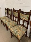 Four carved dining chairs with upholstered seats