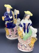 A pair of Staffordshire figures of a couple