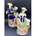A pair of Staffordshire figures of a couple