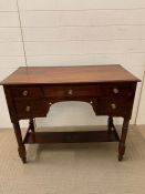 A mahogany sideboard with an assortment of five drawers (H78cm W96cm D47cm)