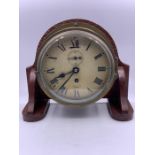 A mounted brass ship bulkhead clock by Smiths Empire (H22cm W26cm D11cm)