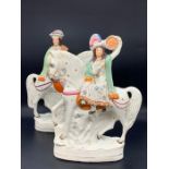 Two Staffordshire flat backs adoring horses