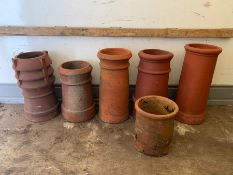 Six terracotta chimney pots various sizes