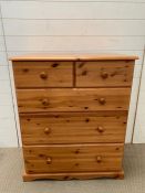A pine two over three chest of drawers (H97cm W80cm D44cm)