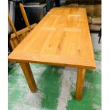A large solid oak eight seater dinning table (H82cm W220cm D90cm) with two extensions (W50cm each)