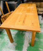 A large solid oak eight seater dinning table (H82cm W220cm D90cm) with two extensions (W50cm each)