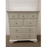 White chest of three over two over two chest of drawers with silver contemporary handles (H113cm