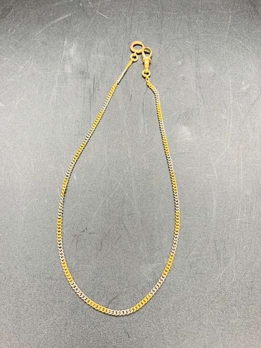 A watch chain marked 18ct (14.3g)