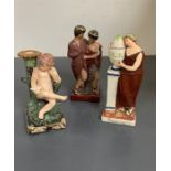 Two china figurines and spill vase of a little boy reading a book
