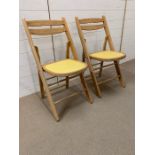 A pair of mid century folding chairs