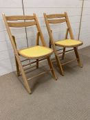 A pair of mid century folding chairs