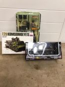 A selection of militaria toys to include T20 Komsomolyets model kit, Power Team set and a M4A3