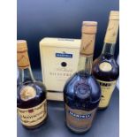 A Selection of four bottles of Brandy by Hine, Martell and Hennessy