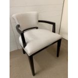 An silver/grey open armchair/dressing table chair with scrolled back