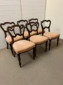 A set of six Victorian rosewood dining chairs with stuff over seats on turned legs