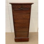 Oak tambour cabinet