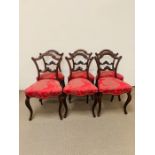 Set of six mahogany dining chairs, shaped back on cabriole legs