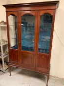 A Mahogany display cabinet with glass shelves and integral lighting with two glass shelves 129 cm