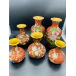 Three pairs of contemporary Chinese Cloisonne vases on red grounds (Heights 13 cm, 15 cm and 21 cm)
