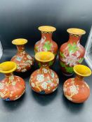 Three pairs of contemporary Chinese Cloisonne vases on red grounds (Heights 13 cm, 15 cm and 21 cm)