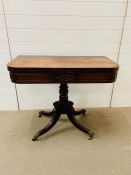 Regency mahogany D-Shaped card table with revolving top on quadripartite base