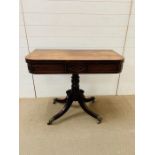 Regency mahogany D-Shaped card table with revolving top on quadripartite base